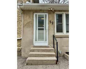 A house with the number 52 on the front door.
