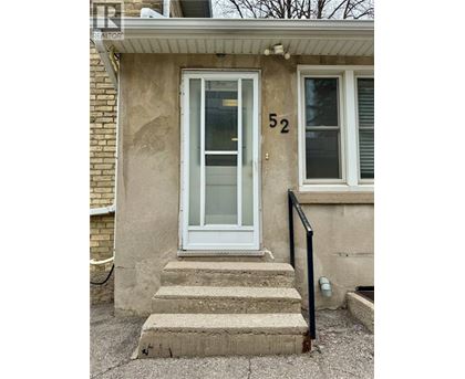 A house with the number 52 on the front door.
