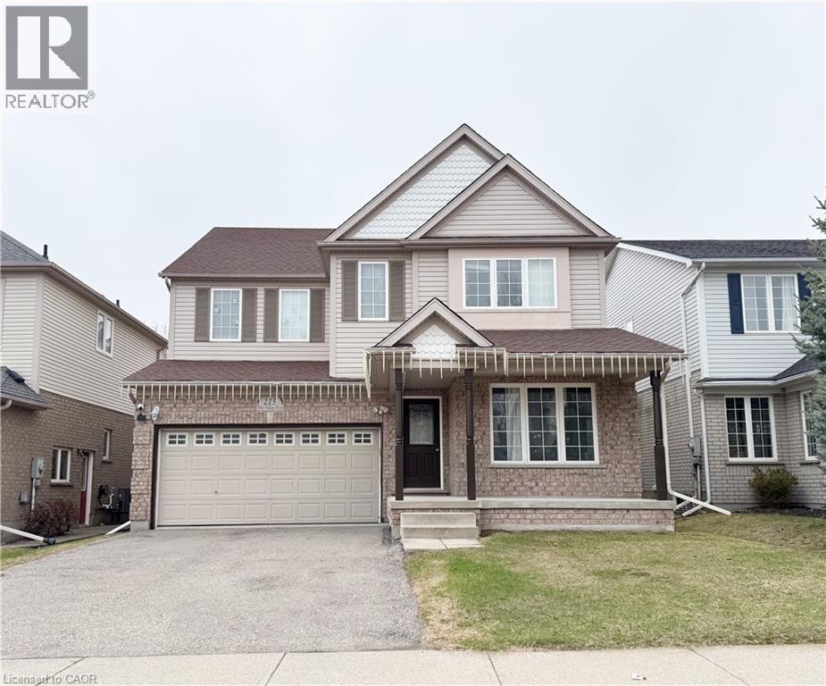 A two-story house with a garage is for sale.
