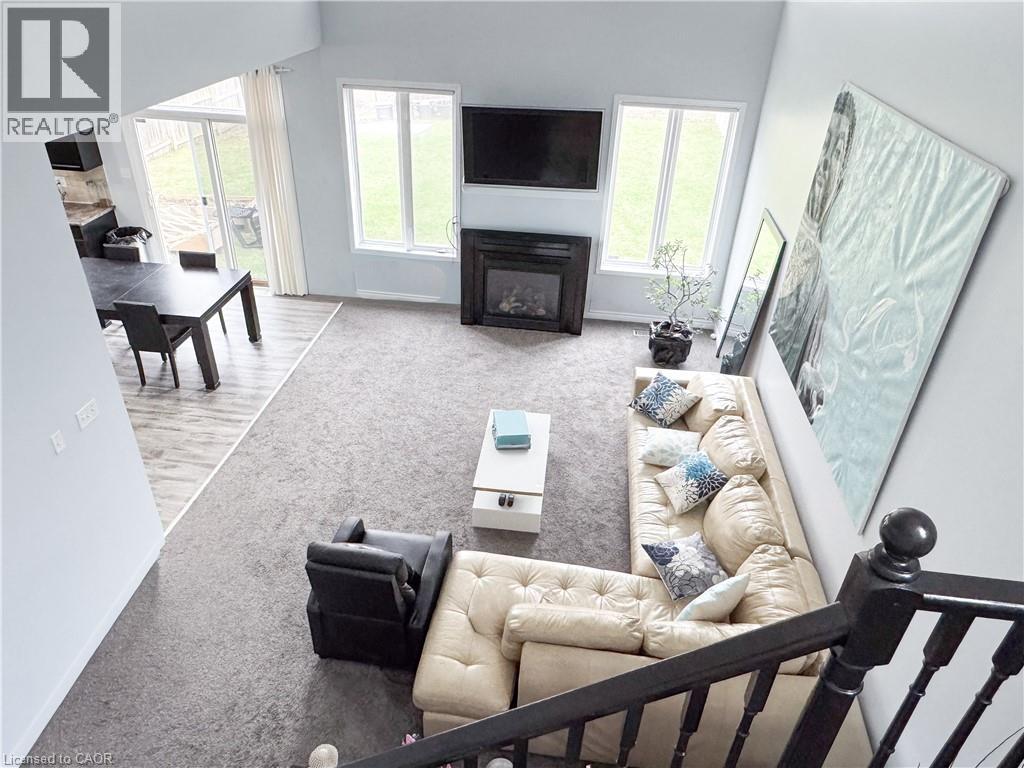 A living room with a fireplace and a couch.