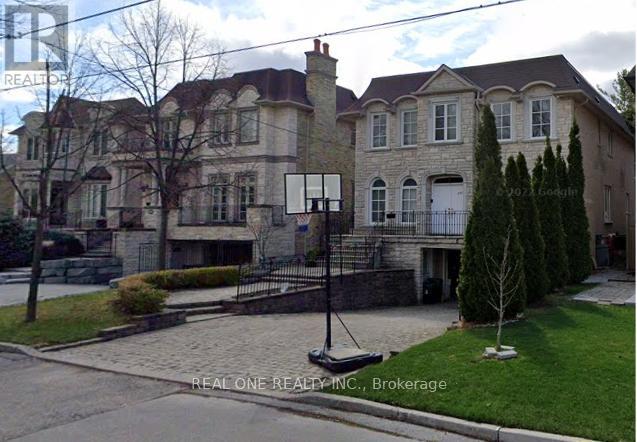 A large house with a stone facade and a white door.