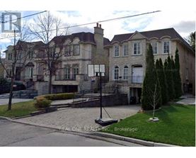 A large house with a stone facade and a white door.