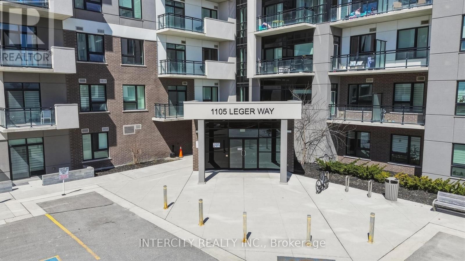 A building with the sign 1105 LEGER WAY in front of it.