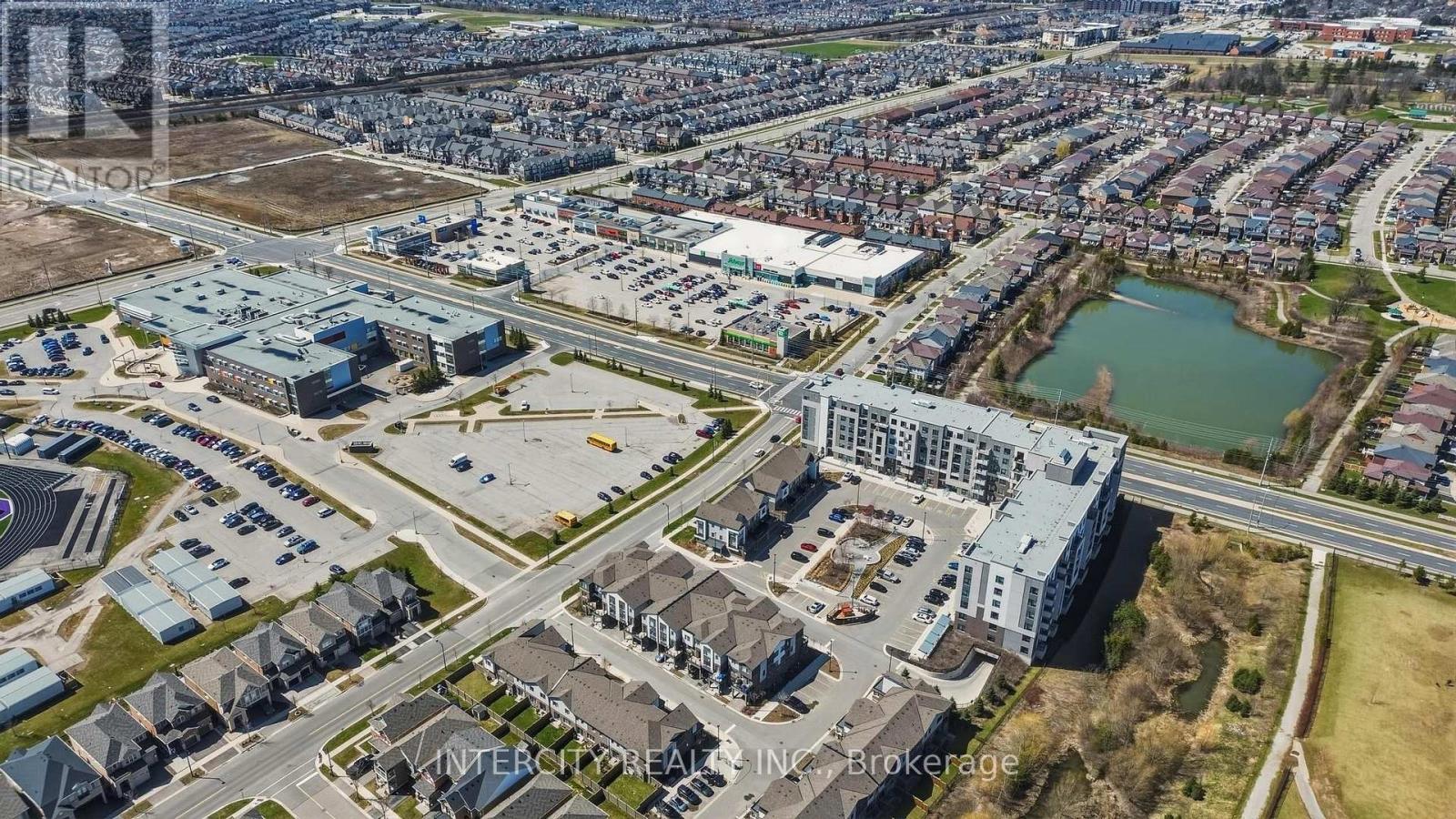 An aerial view of a city with a mix of residential and commercial buildings.