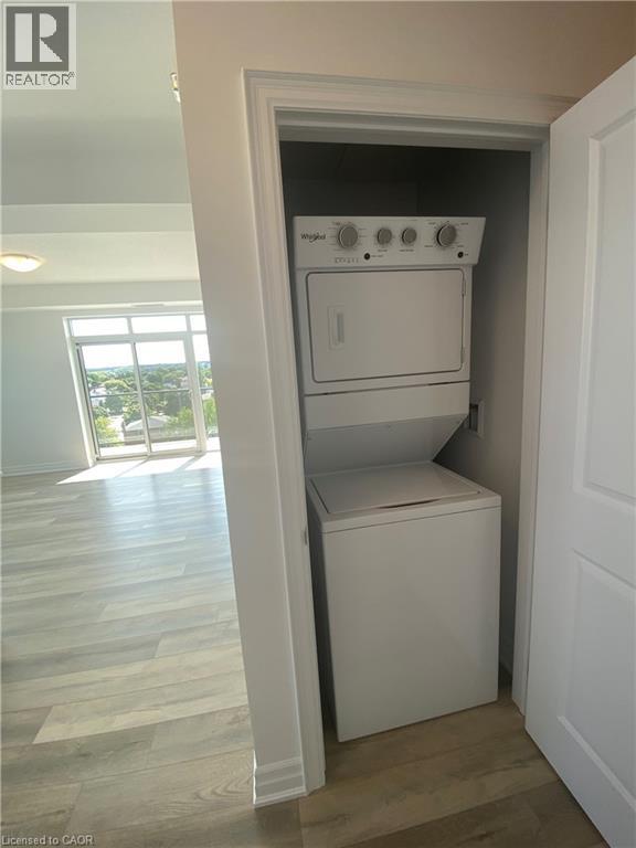 A white oven and dishwasher in a small kitchen.