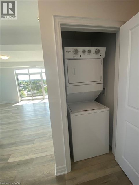 A white oven and dishwasher in a small kitchen.