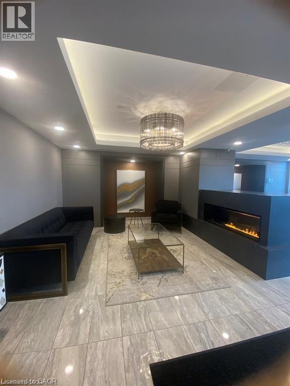 A modern living room with a fireplace and a large mirror on the wall.