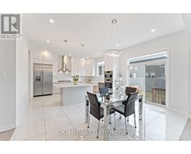 A modern kitchen with a glass table and chairs.