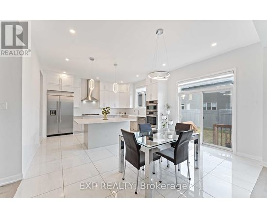 A modern kitchen with a glass table and chairs.