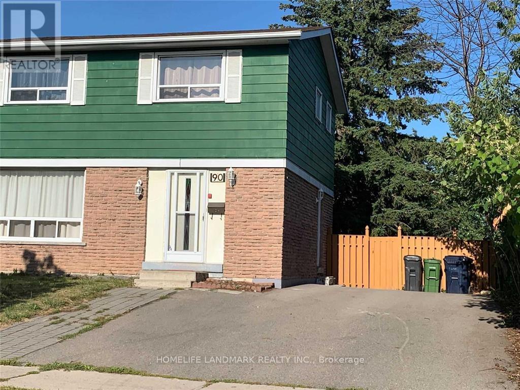 A green house with a white door and windows is for sale.