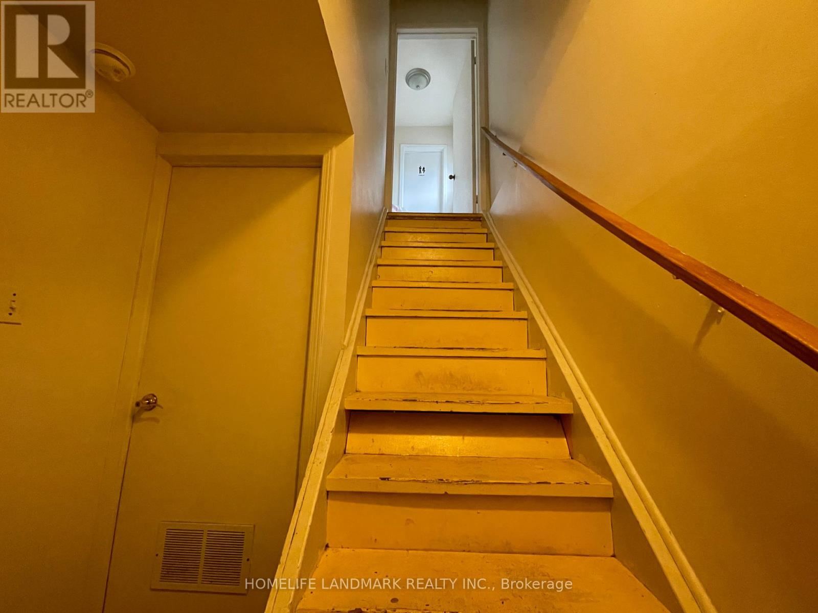 A staircase leading to a door at the end.