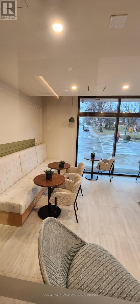A modern living room with a white sofa and a coffee table.
