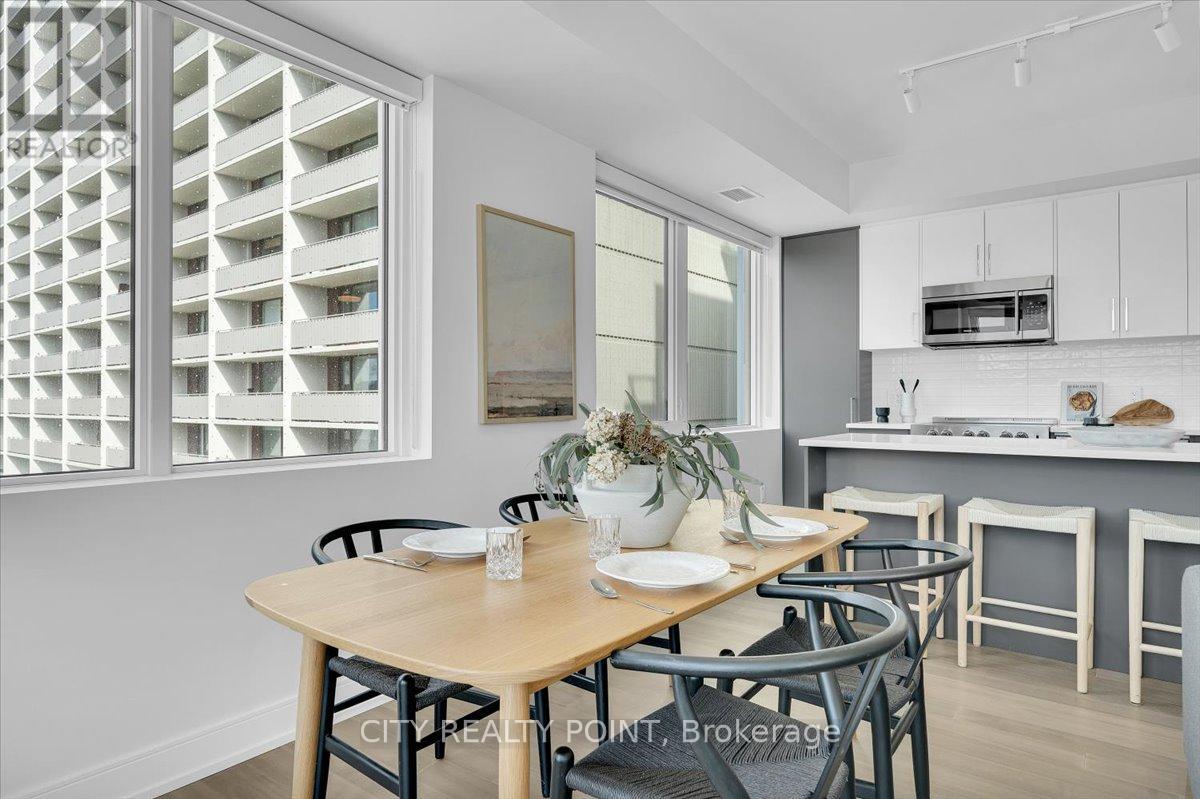 A dining area with a table set for two.
