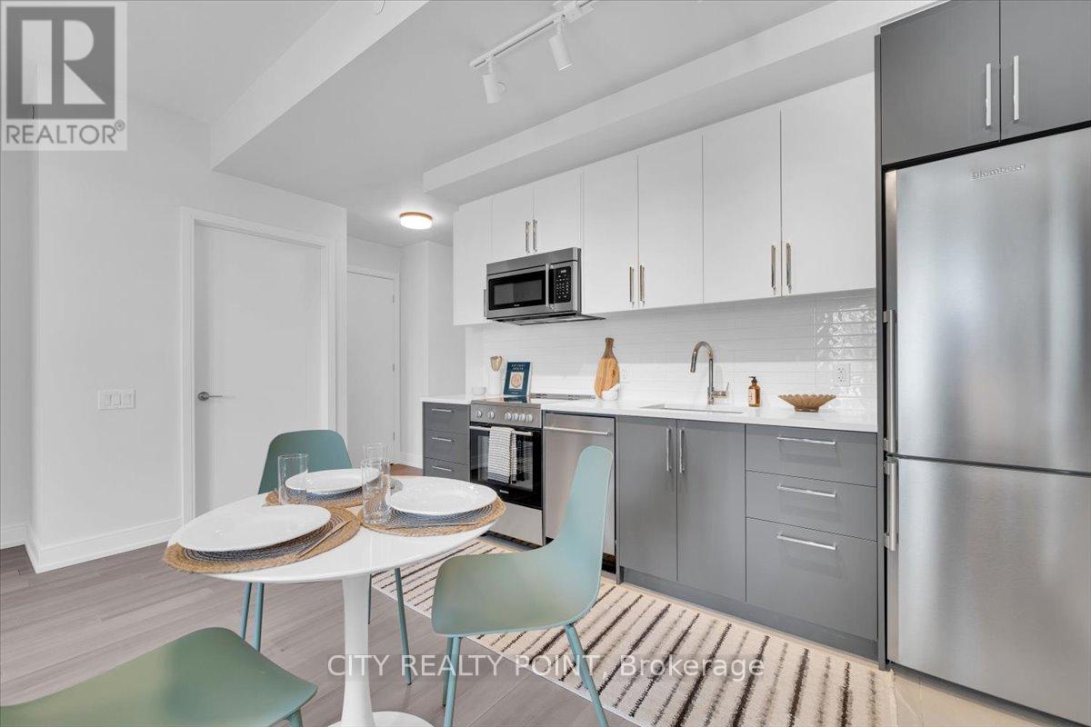 A modern kitchen with a dining table and chairs.