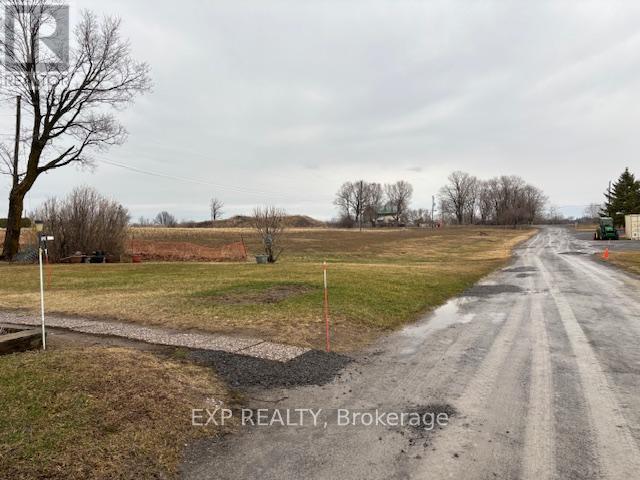 A road with EXP REALTY, Brokerage written on it.