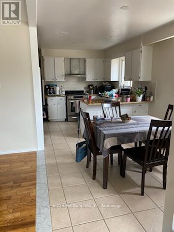 A dining room with a table set for four.