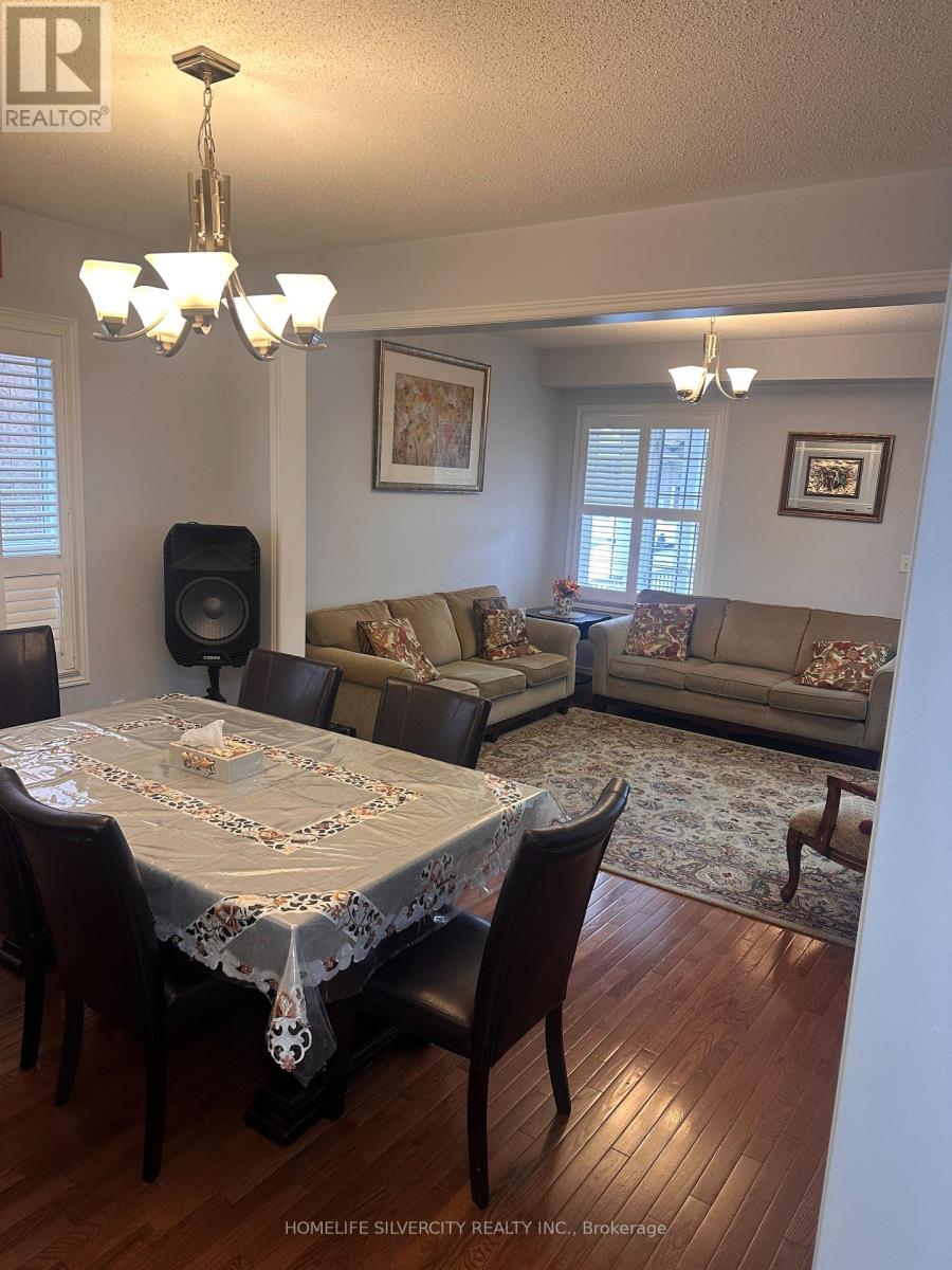 A dining room with a table set for six.