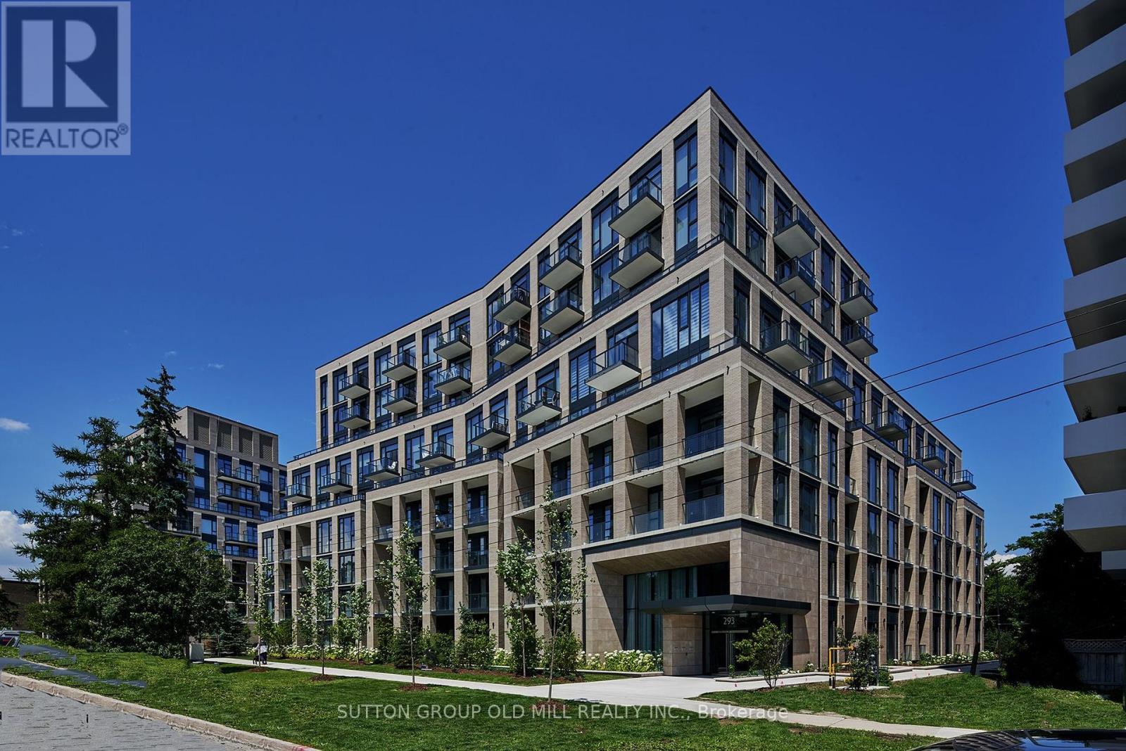 A modern building with a glass facade is the main focus of the image.