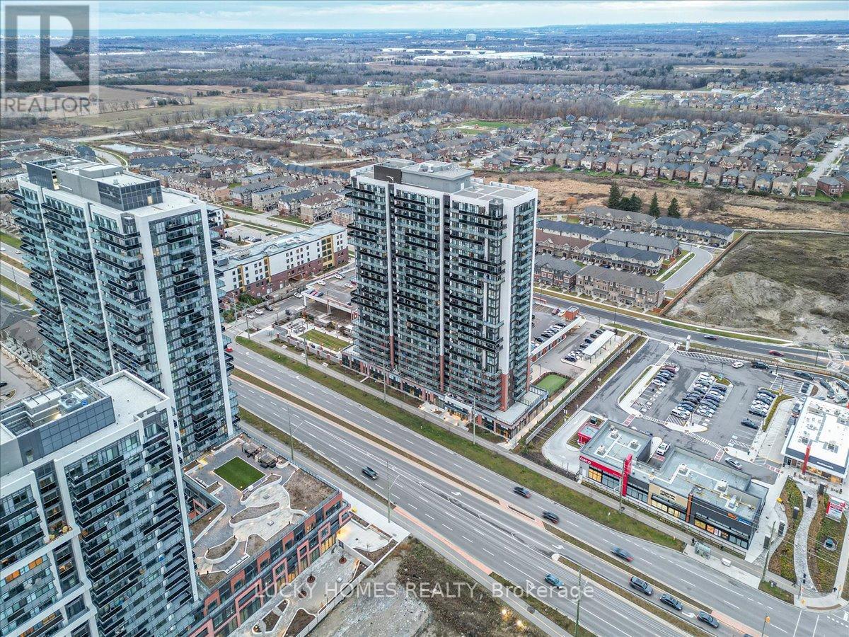 A cityscape with apartment buildings and a highway.