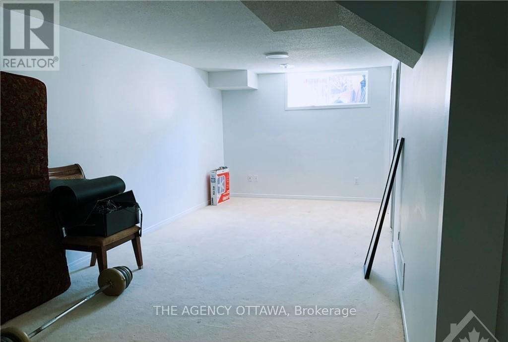 A room with a chair and a table in it.
