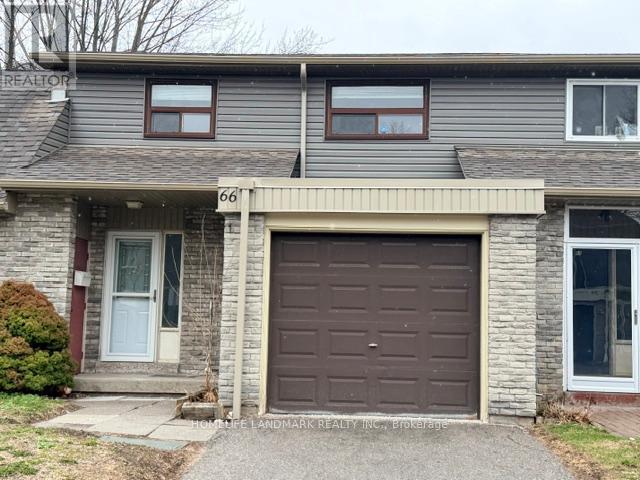House number 66 has a brown garage door.