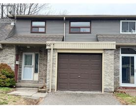 House number 66 has a brown garage door.