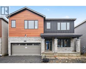 A modern two-story house with a garage.