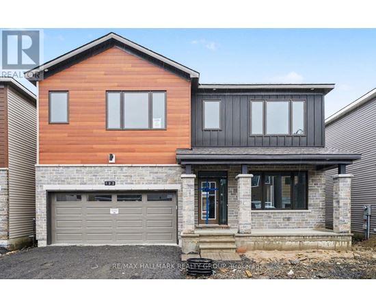 A modern two-story house with a garage.