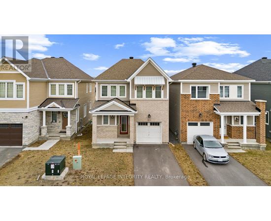 A row of houses with a car parked in front of the last one.
