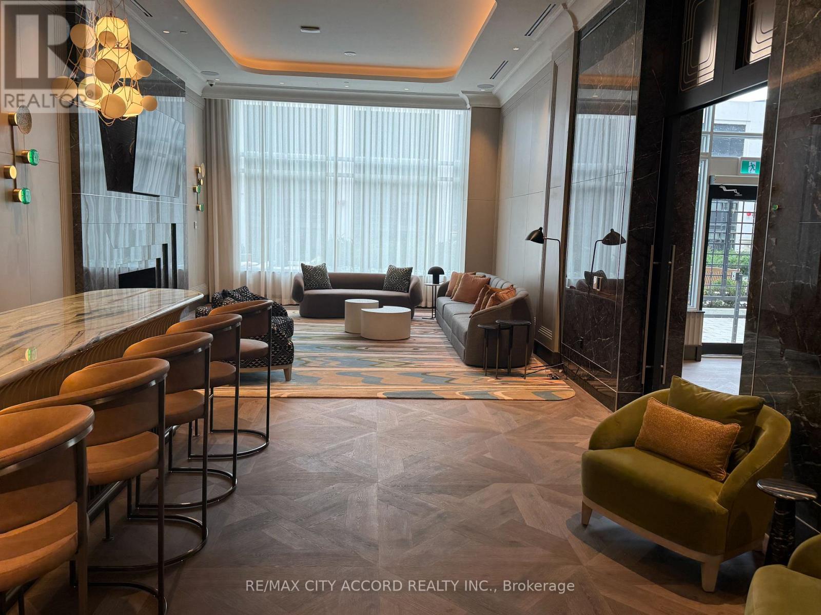 A well-lit, modern lounge area with a bar and comfortable seating.