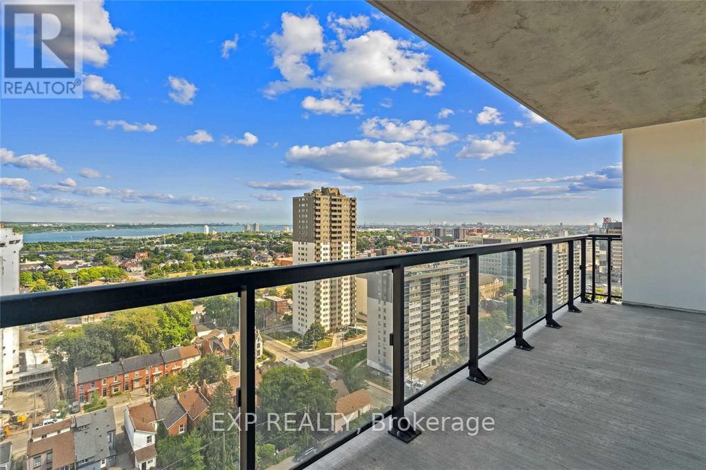 A balcony with a view of a cityscape and buildings.