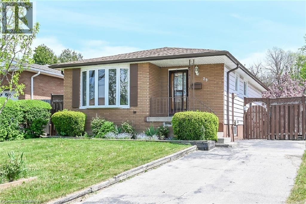 A house with a brown brick exterior and a brown door.