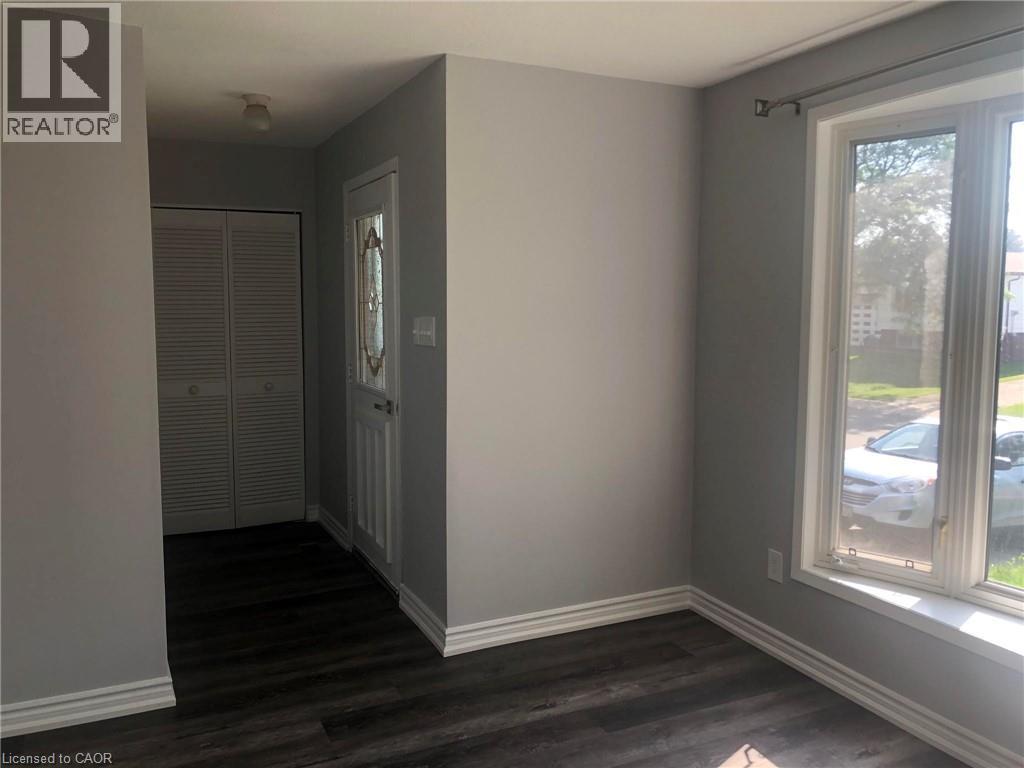 A room with a window and a door.