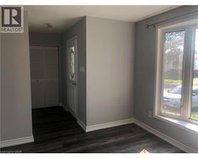 A room with a window and a door.