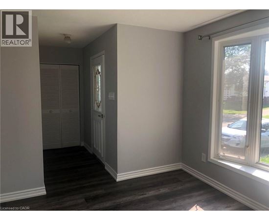 A room with a window and a door.