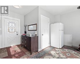 A bedroom with a dresser and a mirror.