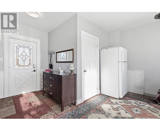 A bedroom with a dresser and a mirror.
