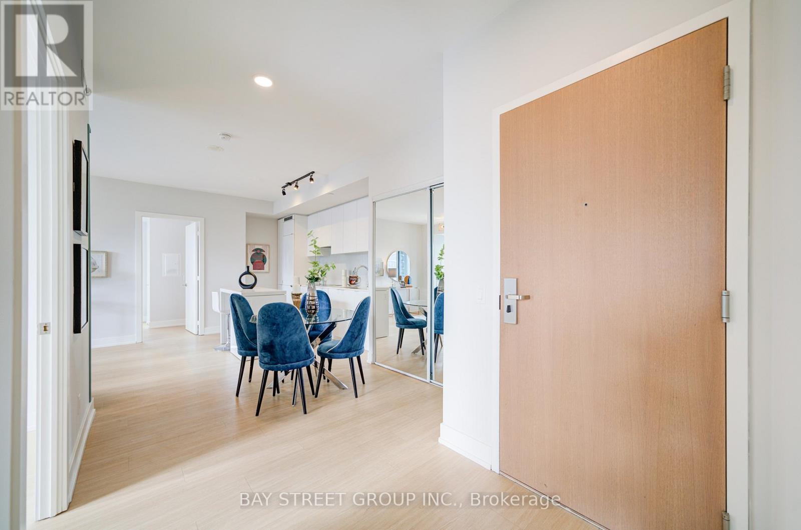 A dining room with a table and chairs is shown in the image.