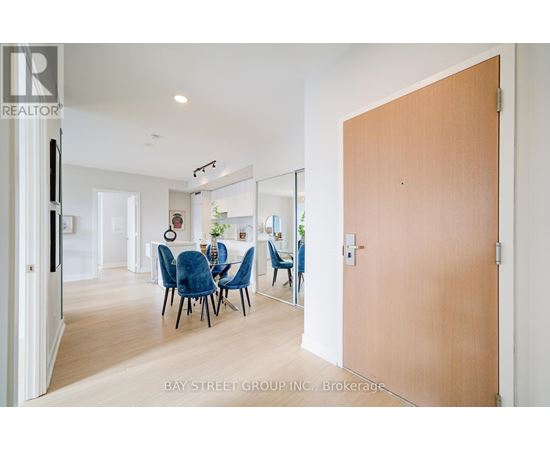 A dining room with a table and chairs is shown in the image.