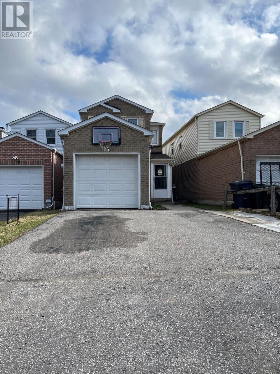 A real estate photo of a house with a garage.