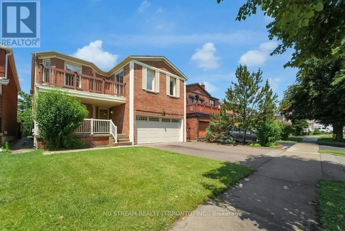 A house with a well-maintained lawn and a clear sky above.