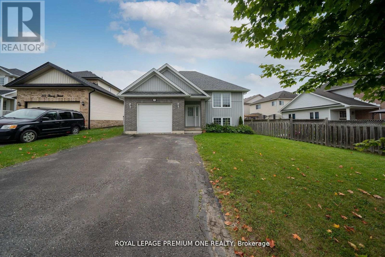 A house with a driveway in front of it.