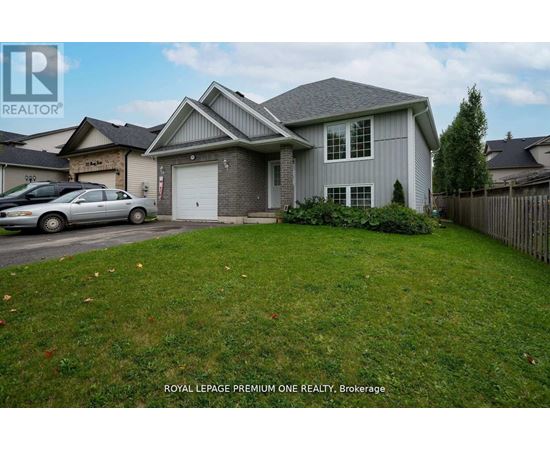 A house with a grey roof and a car parked in front.