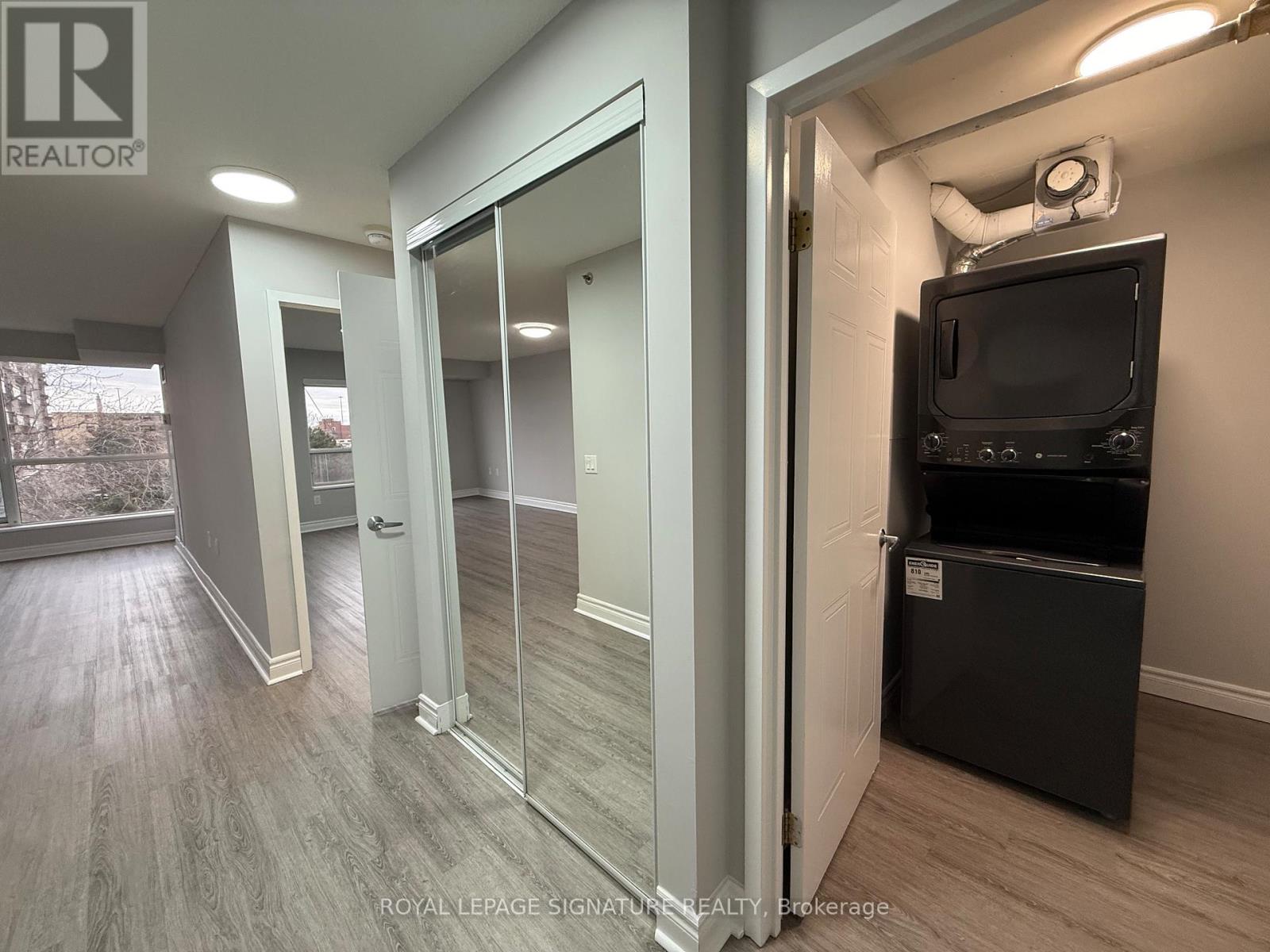 A room with a television and a sliding glass door.