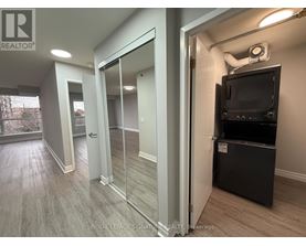 A room with a television and a sliding glass door.