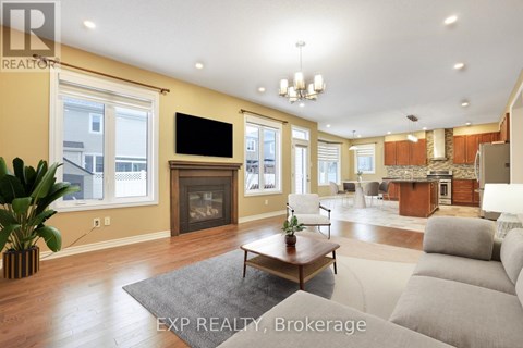 A living room with a grey couch and a wooden coffee table.