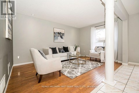 A living room with a white couch and a coffee table.