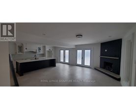 A spacious living room with a fireplace and sliding glass doors.
