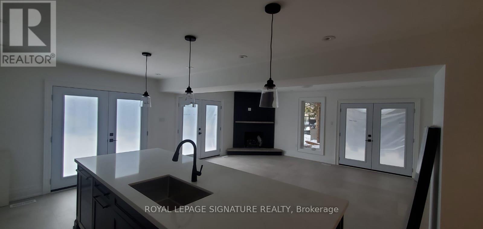 A modern kitchen with a sink and a large island.