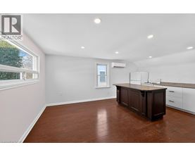 A spacious room with a large island in the middle.